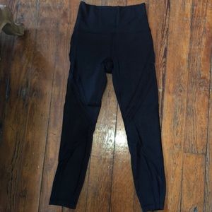 Black Lulu Lemon athletic pants with mesh detail